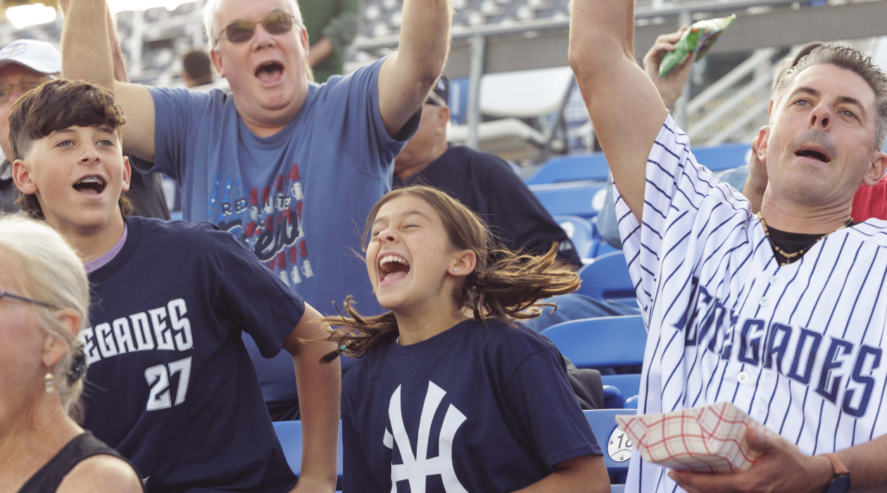 Family celebrating Hudson Valley Renegades game with Dad